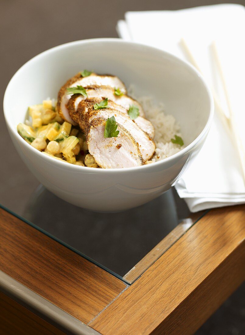 Sliced pork fillet on pearl barley risotto and rice
