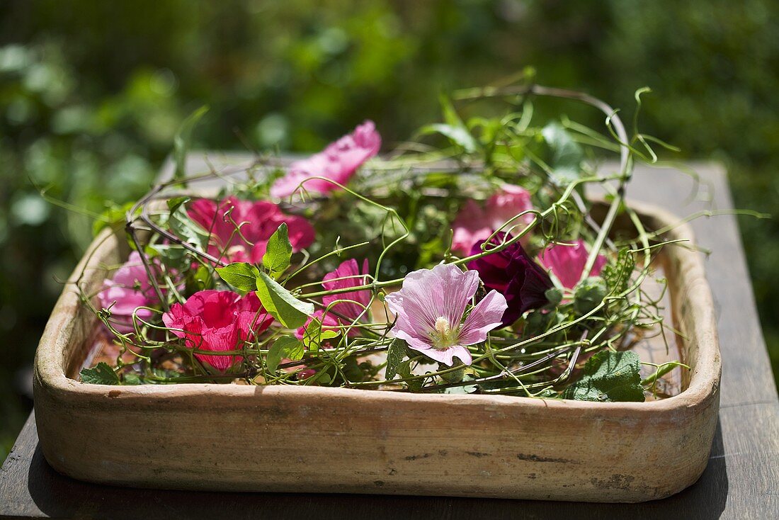 Wreath of hollyhocks and clematis stems