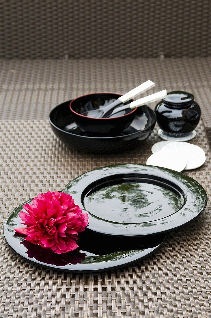Black Asian tableware with a flower