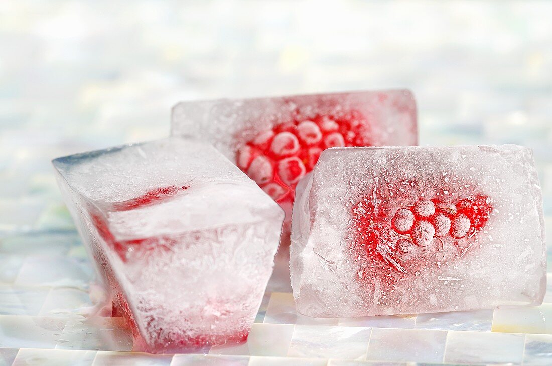 Three raspberry ice cubes