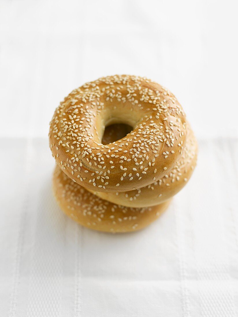 Three sesame bagels, stacked