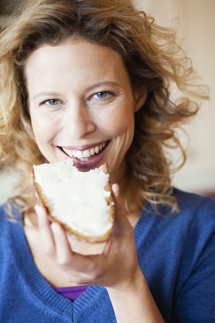 Woman eating bread and butter