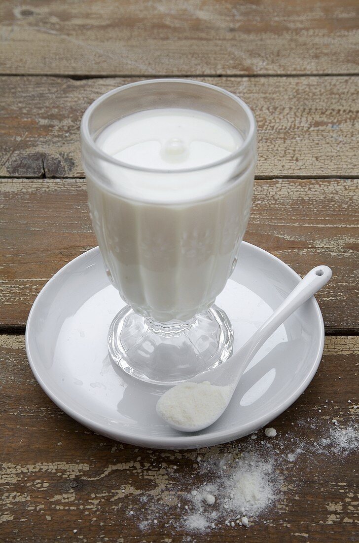 Glass of milk with powdered milk