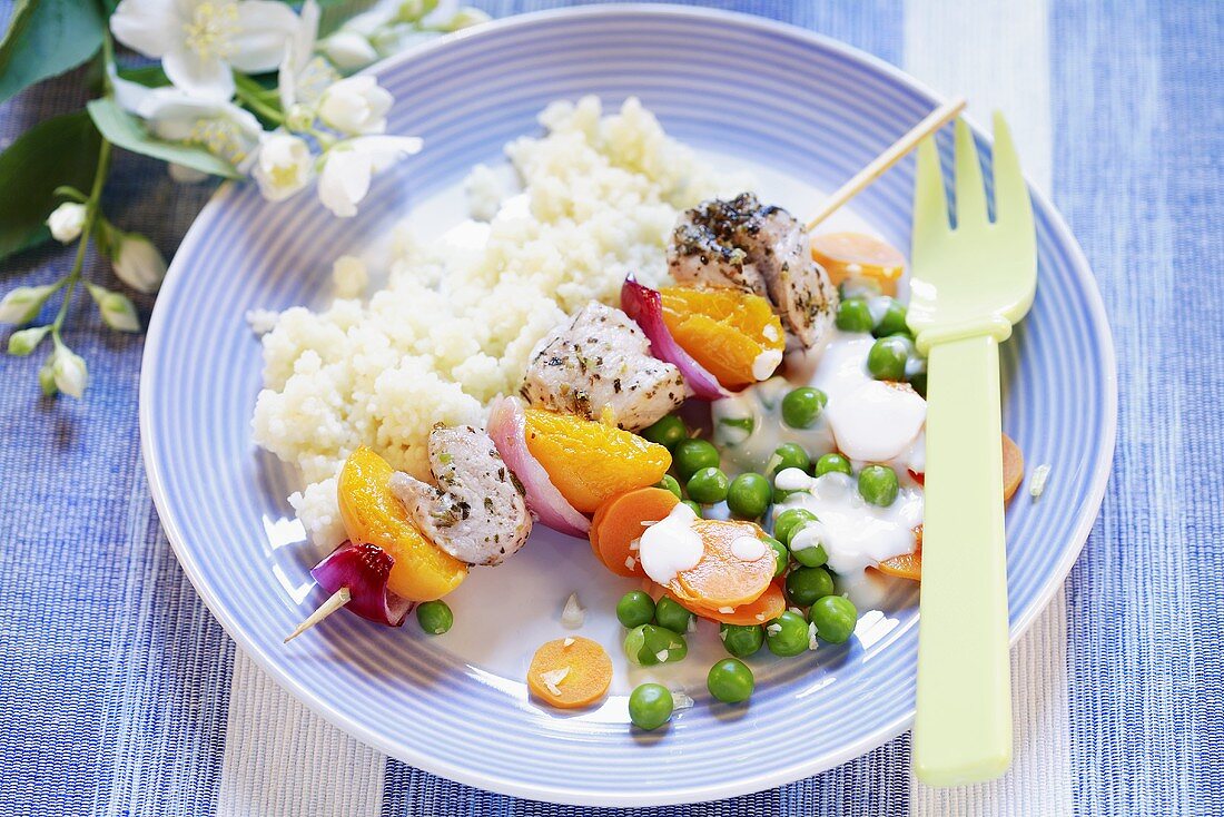 Colourful kebab with rice and vegetables for children
