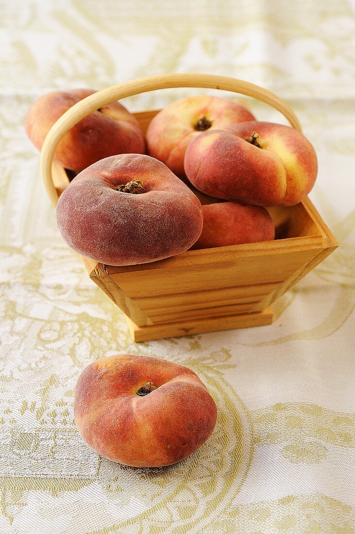 Vineyard peaches in a wooden basket
