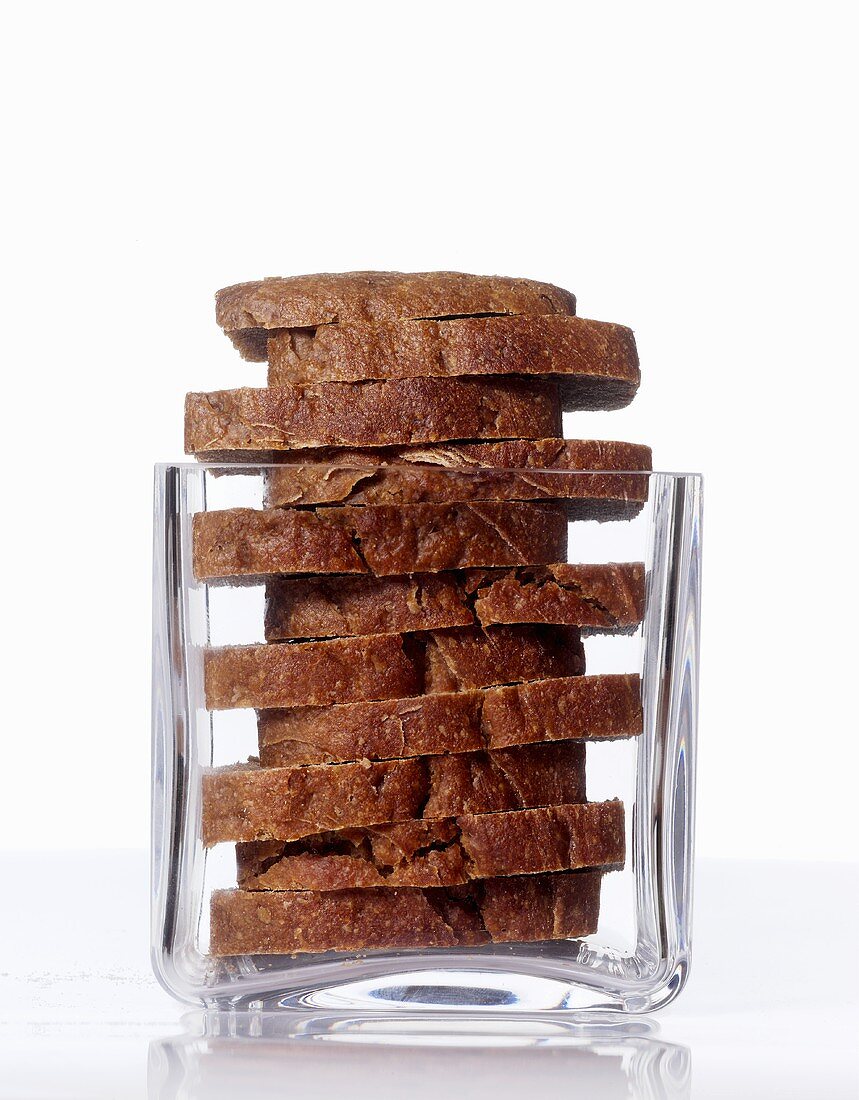 Slices of rye bread in a square glass