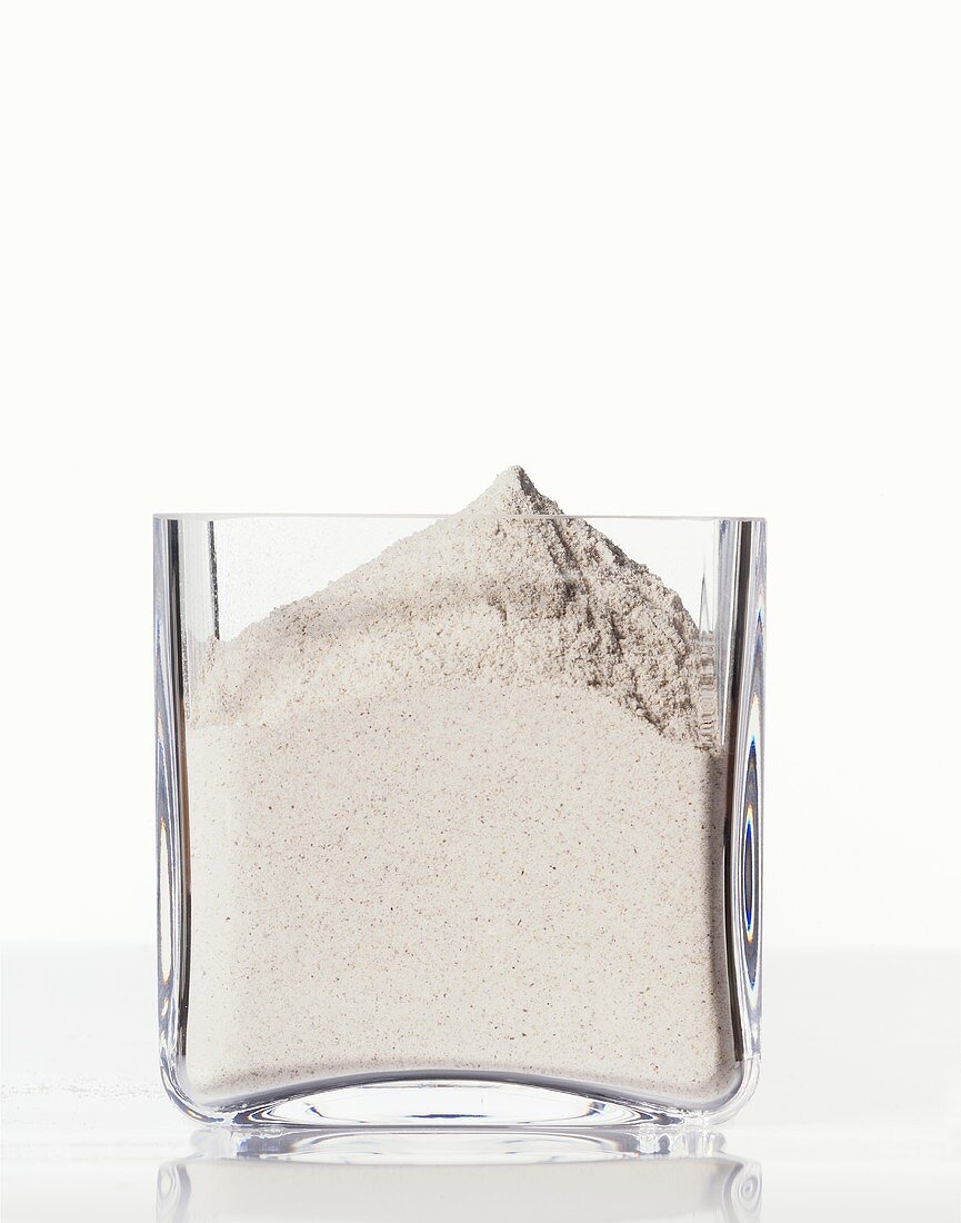 Buckwheat flour in a square glass