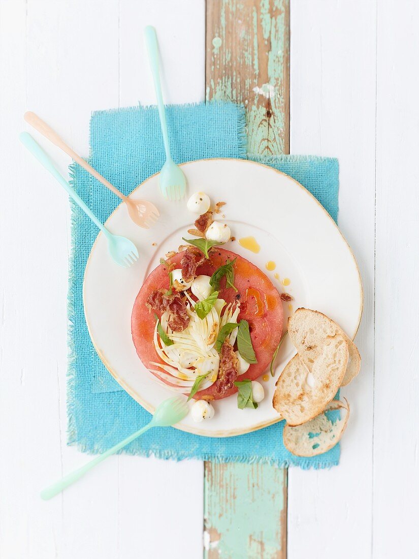 Watermelon with marinated fennel and crispy ham