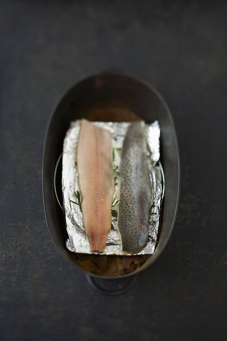 Smoked trout fillets in cast-iron pan