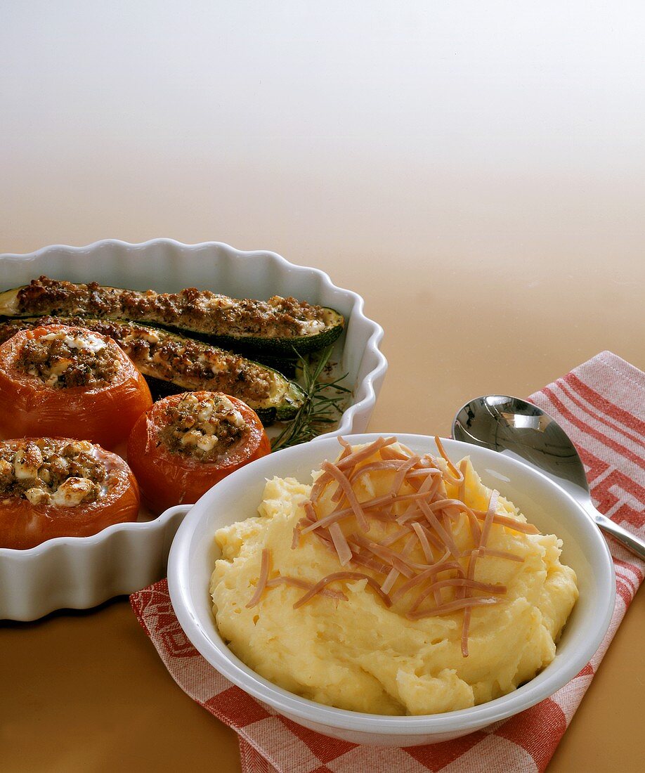 Mashed Potatoes with Stuffed Tomatoes and Zucchini