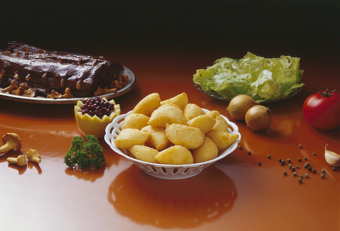 Deep-fried potato dumplings to serve with saddle of hare