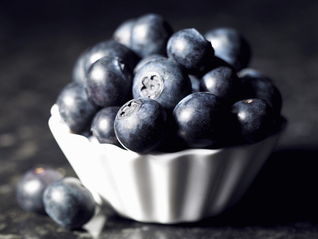 Fresh blueberries in a small dish