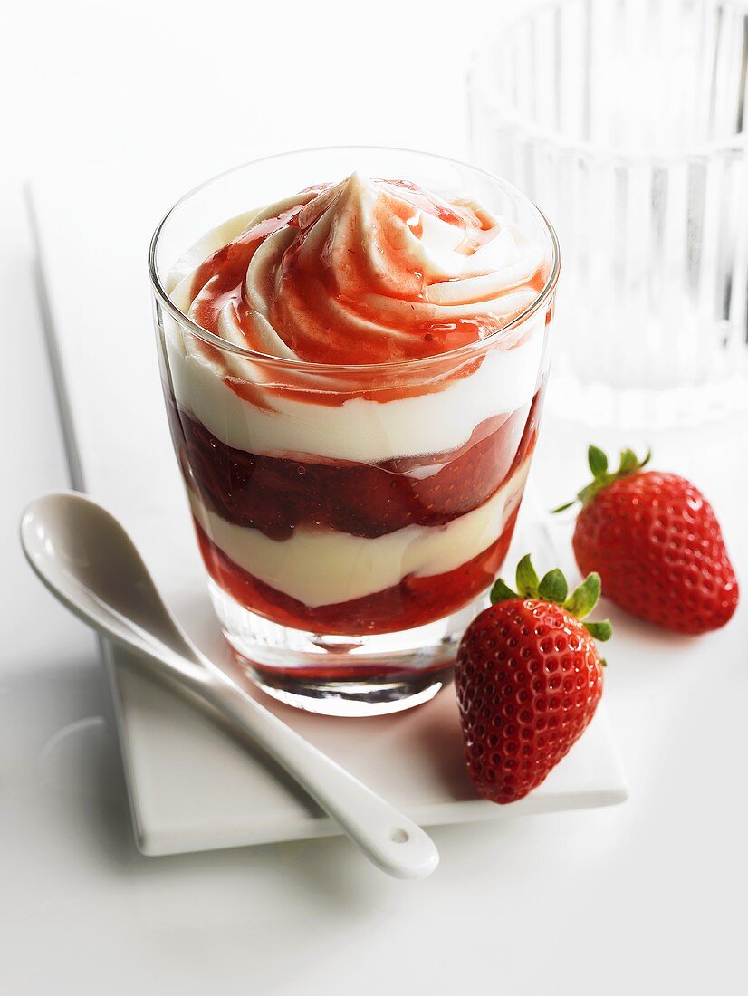 Vanilla cream and strawberries layered in a glass