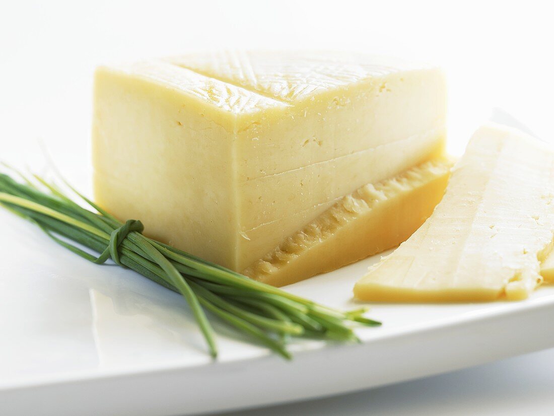 A piece of Parmesan with chives