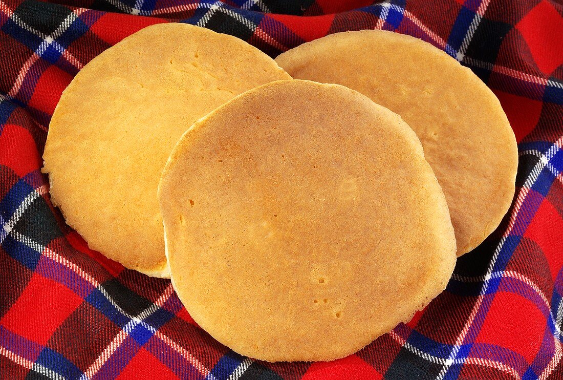 Three Scotch pancakes on tartan