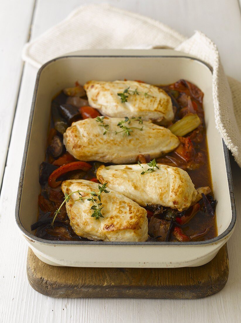 Roast chicken breasts on peppers