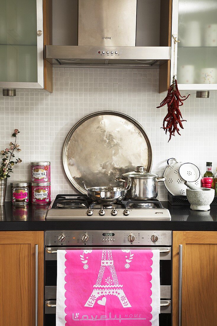 Cooker with tea towel and pans