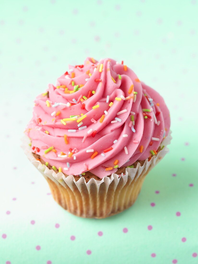A cupcake with rosette of pink icing