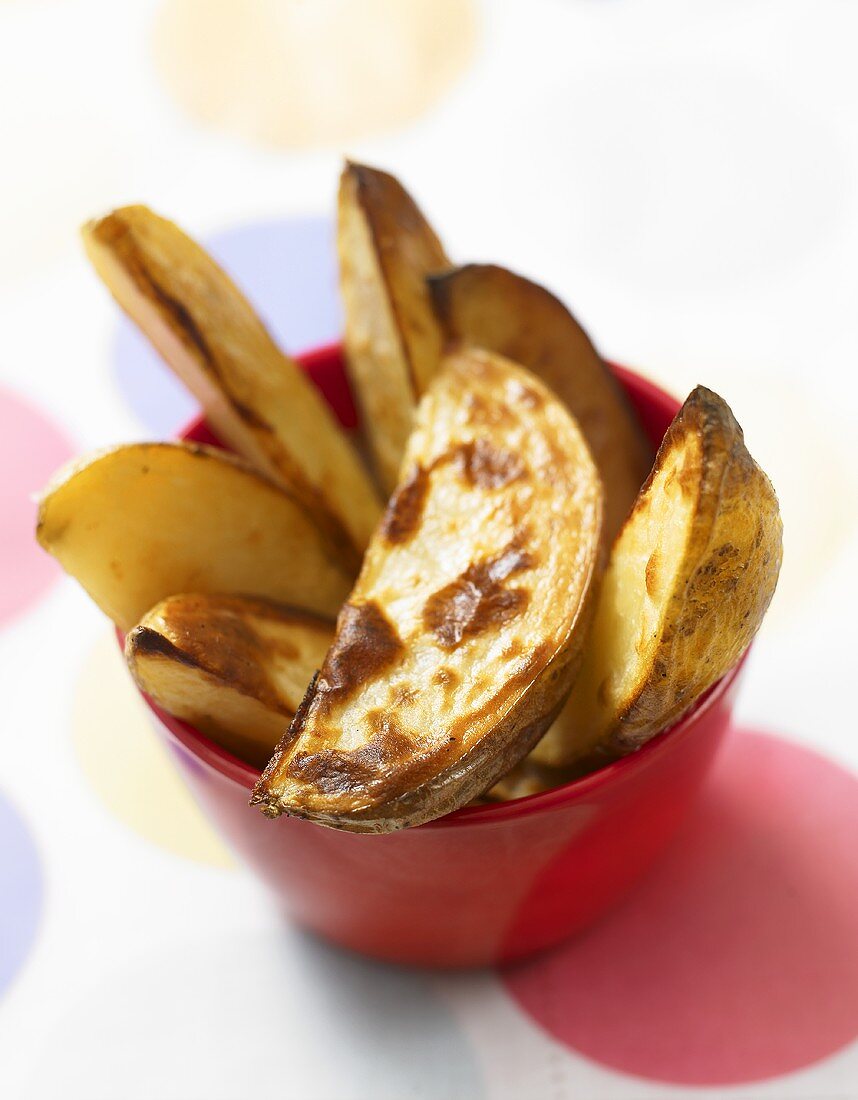 Baked potato wedges in a bowl