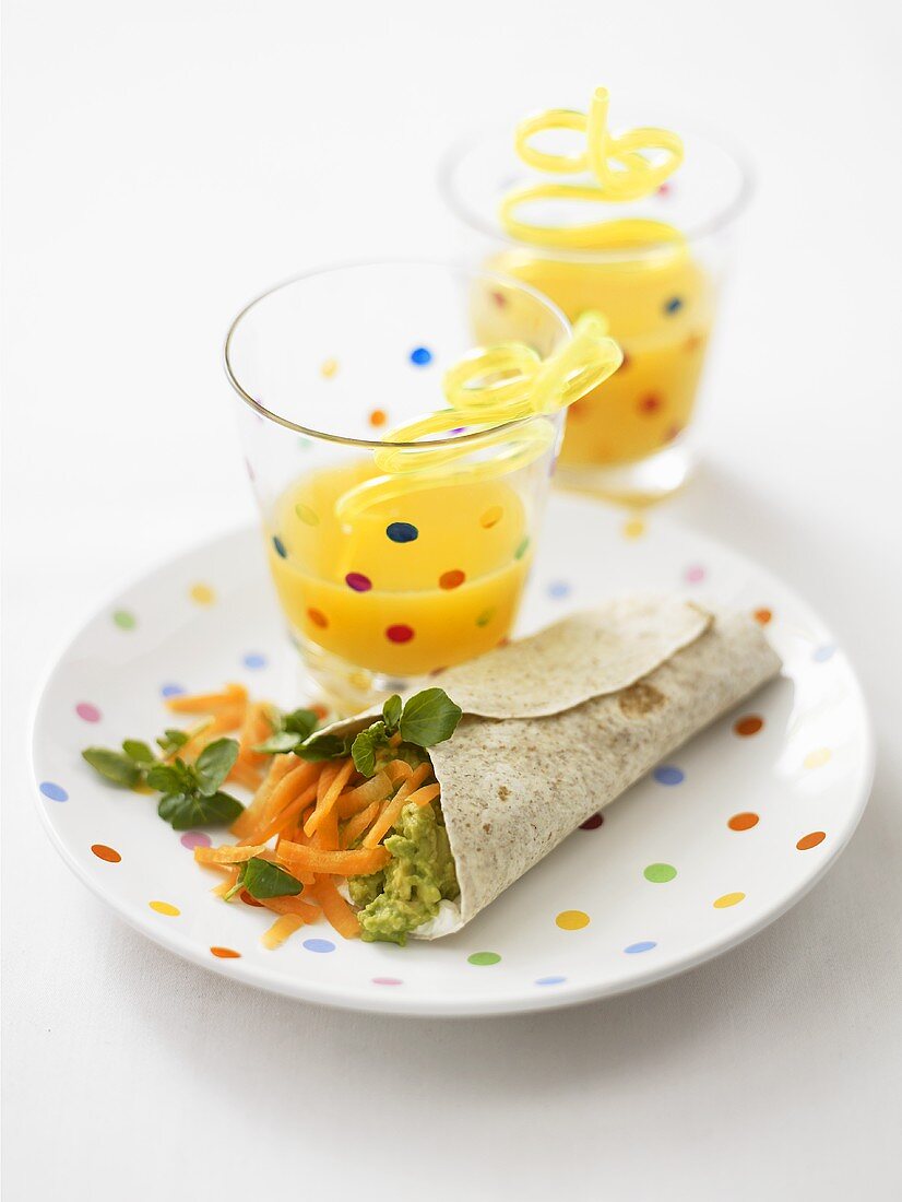 Avocado and carrot wrap with fruit juice