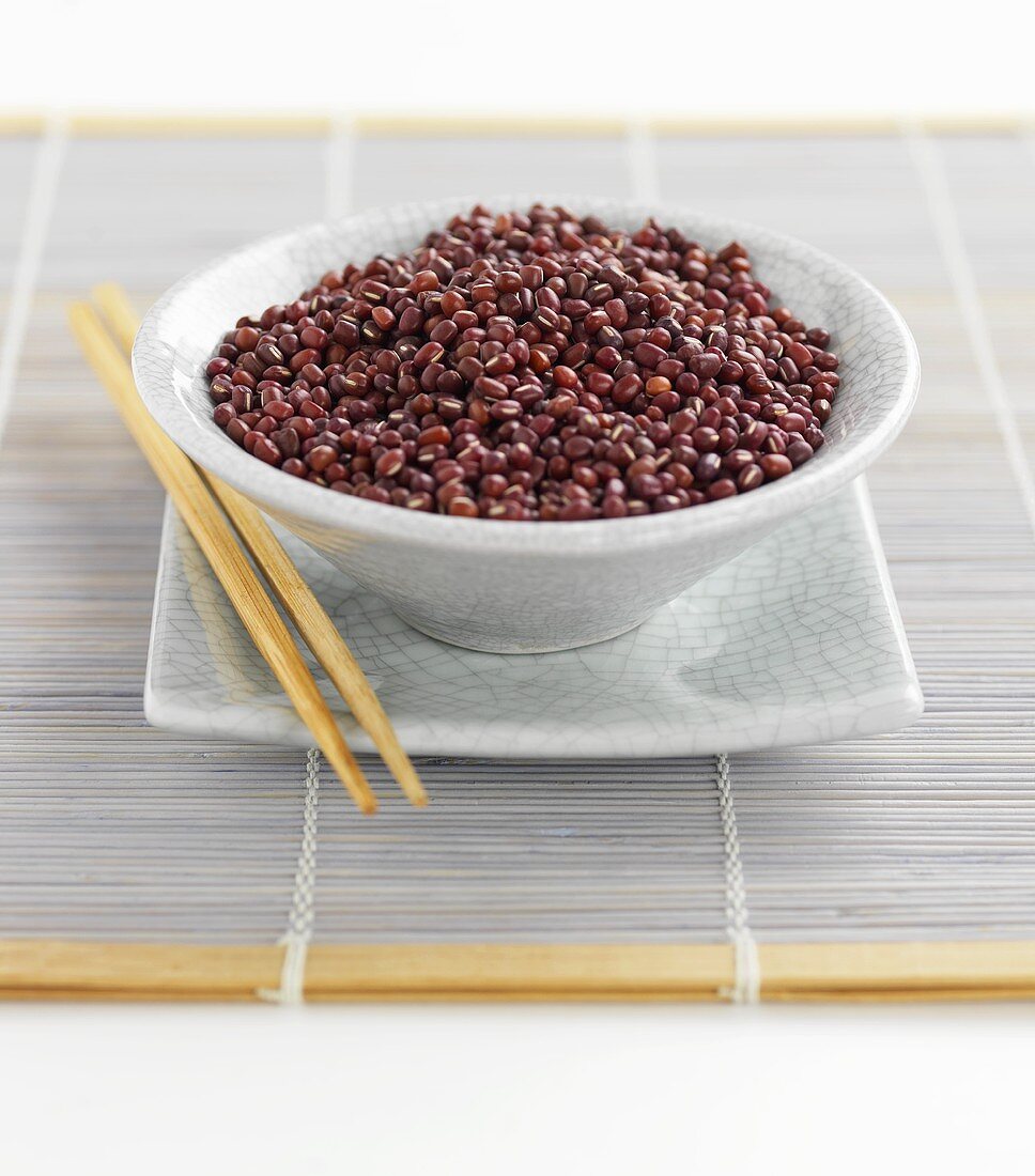 Azuki beans in bowl with chopsticks