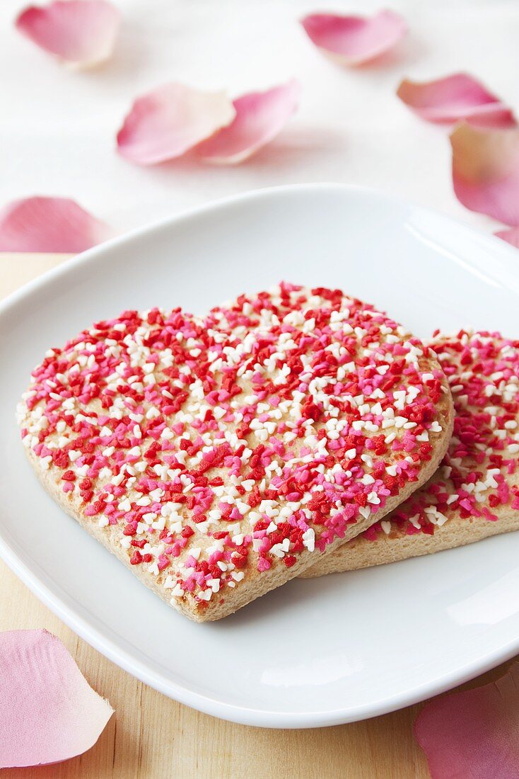 Heart-shaped biscuits with sprinkles