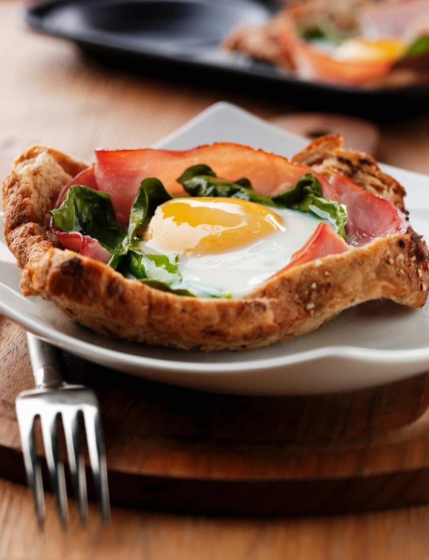 Ham, spinach and fried egg on toast