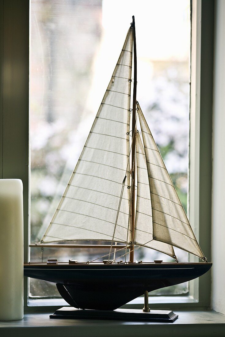 Model yacht by a window