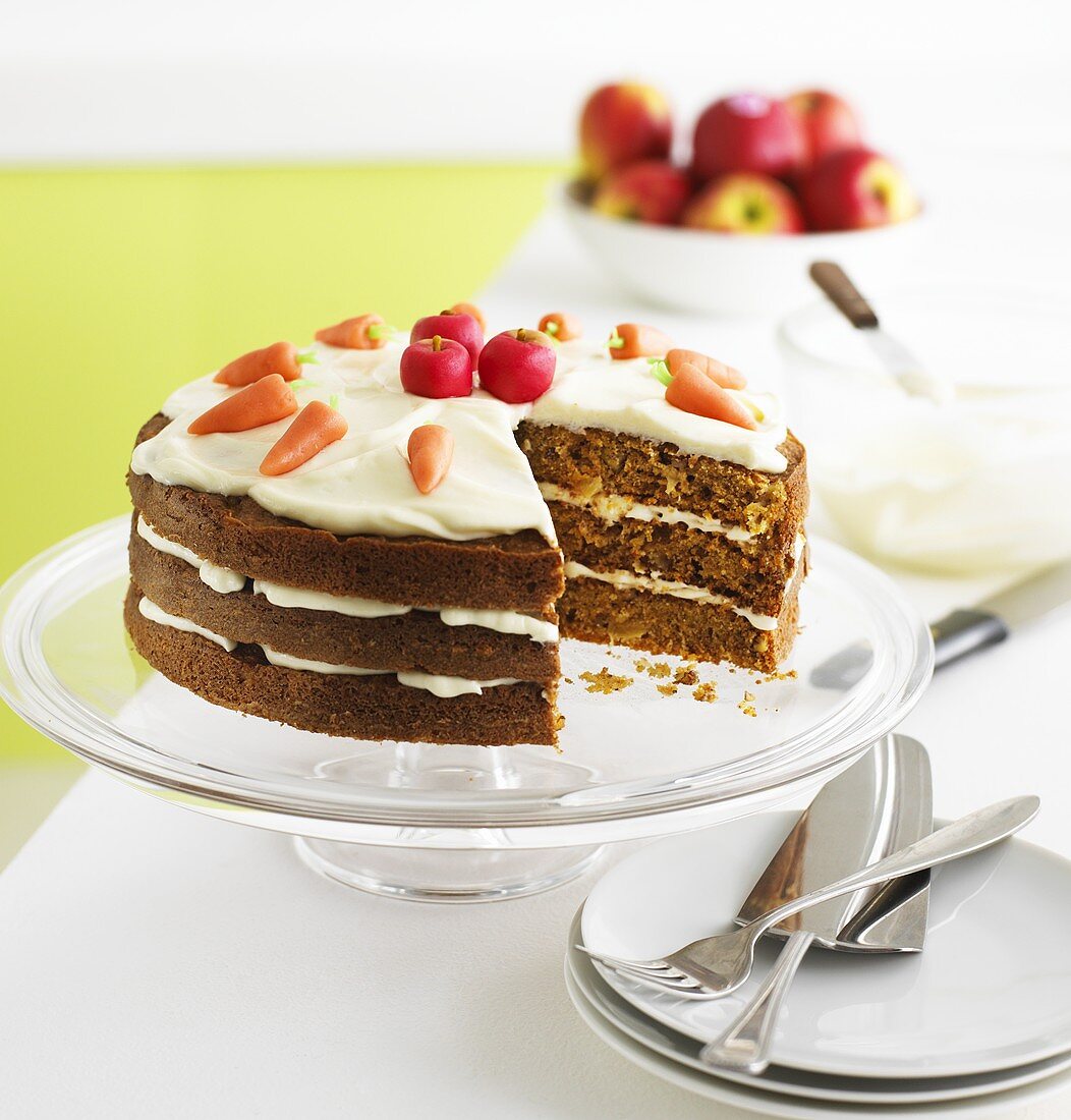 Carrot and apple cake with cream and marzipan fruit