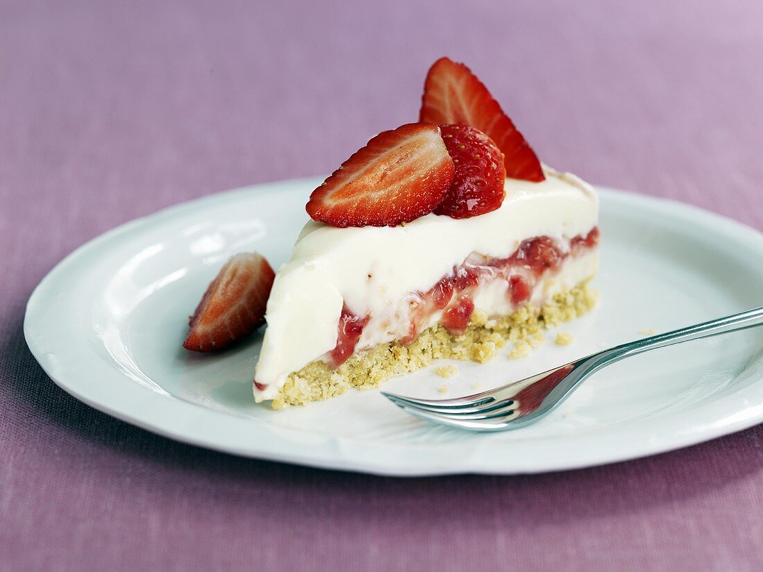 A slice of strawberry cheesecake