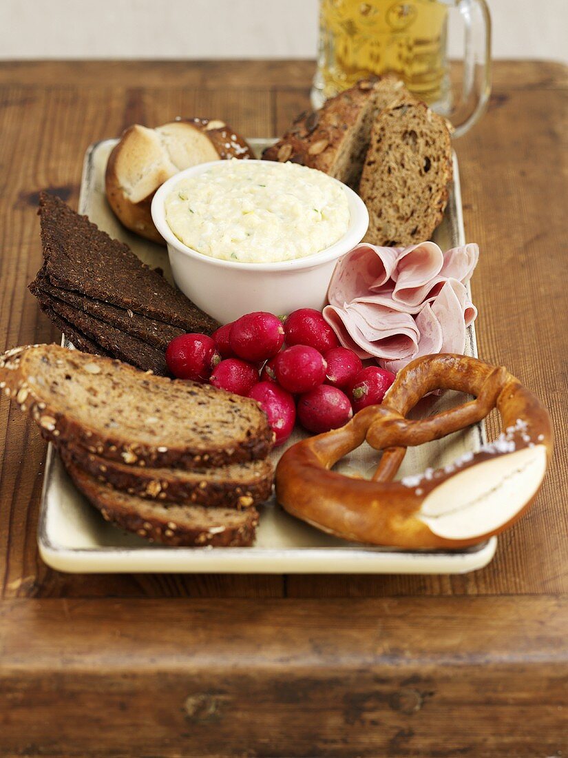 Bavarian snack with bread, pretzel and obatzda