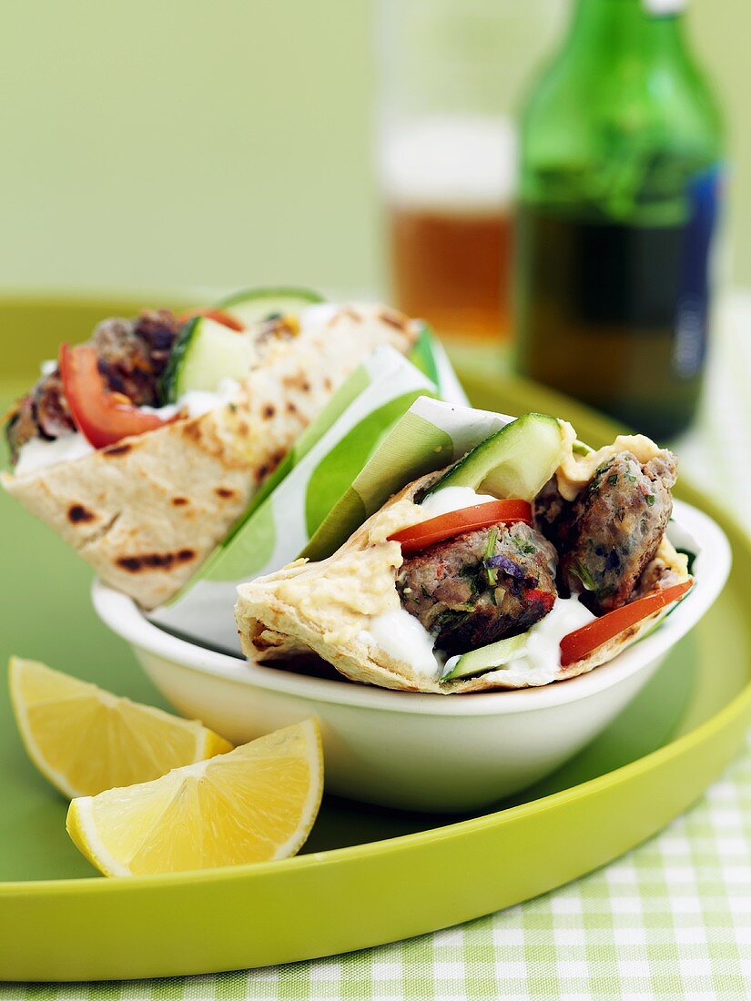 Pita bread filled with lamb, cucumbers and tomatoes