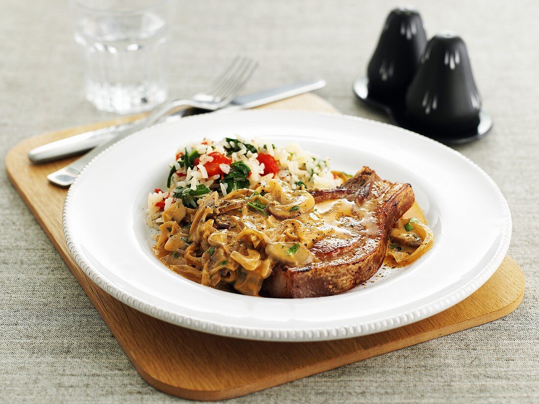 Pork chop with mushroom sauce and rice