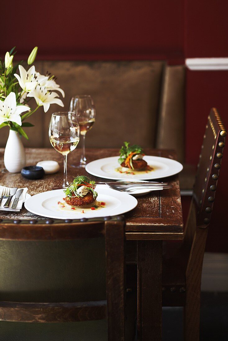 Fish cakes on a set table