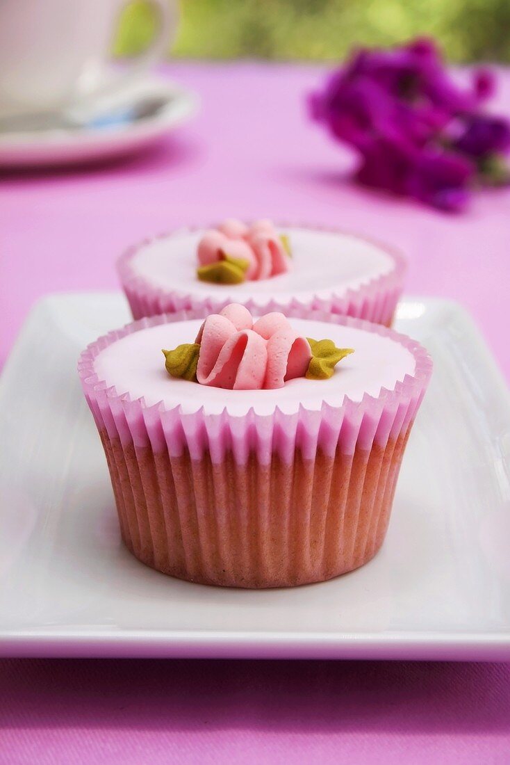 Pink cupcakes with sugar flowers