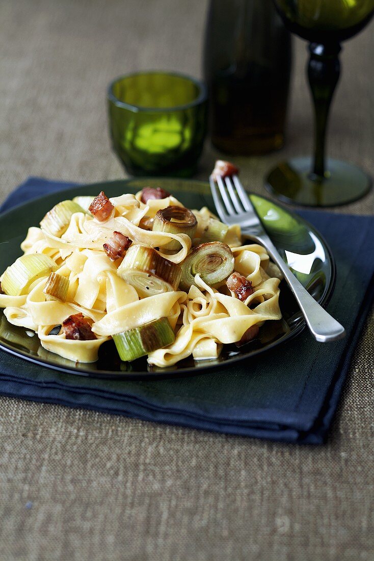 Ribbon pasta with bacon and leeks