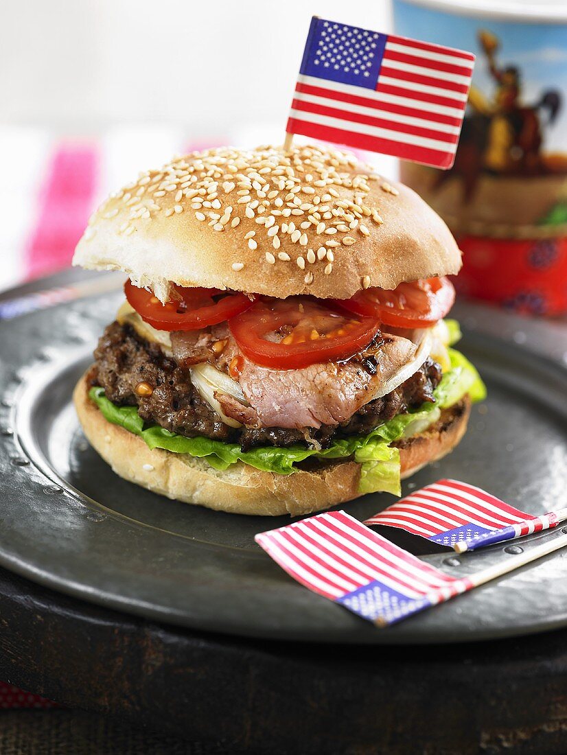 Burger with ham, tomato and lettuce