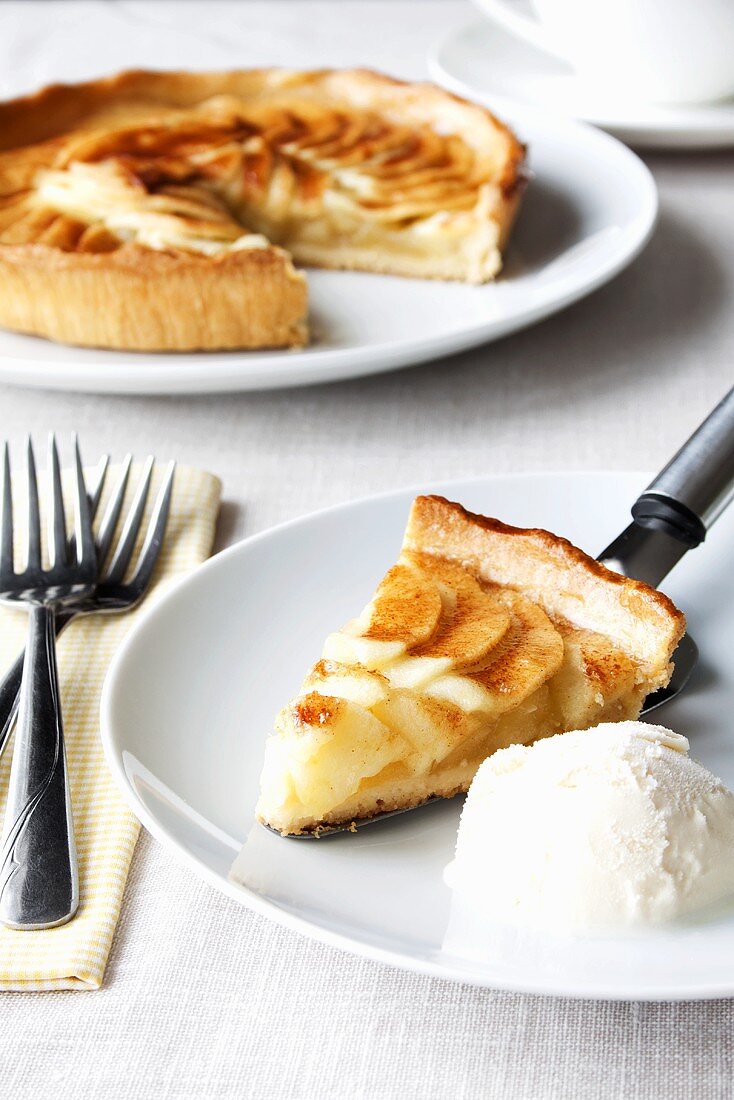 A piece of apple tart with vanilla ice cream