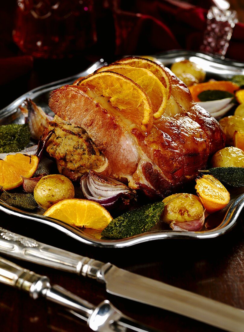 Roast ham with apple and apricot stuffing and orange crust