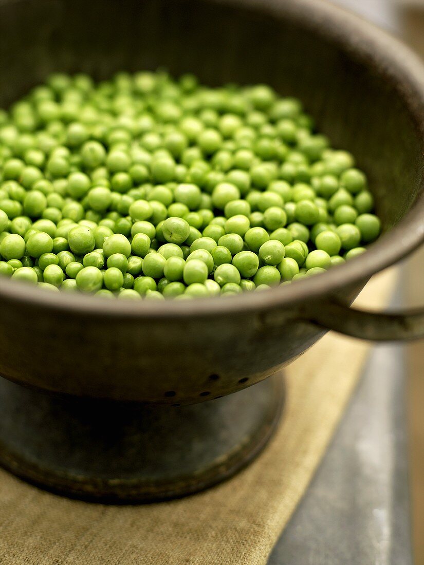 Peas in an old colander