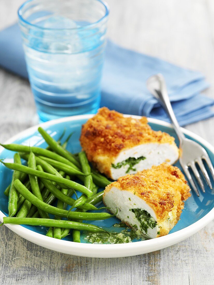 Chicken Kiev (breaded, stuffed chicken breast) with green beans