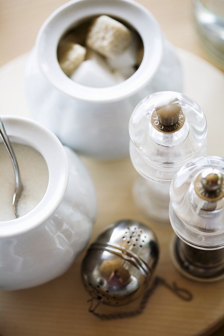 Salt and pepper shakers, tea infuser and sugar bowls