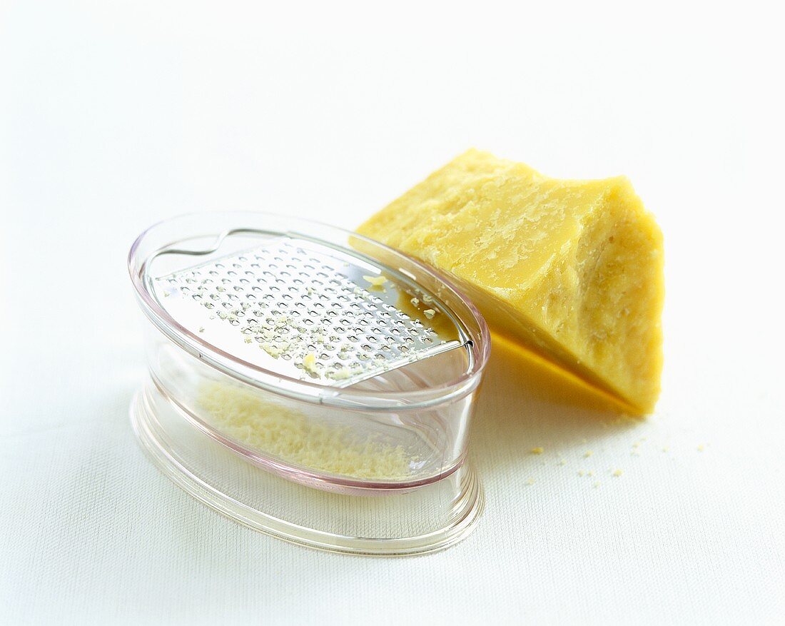 Piece of Parmesan with grater