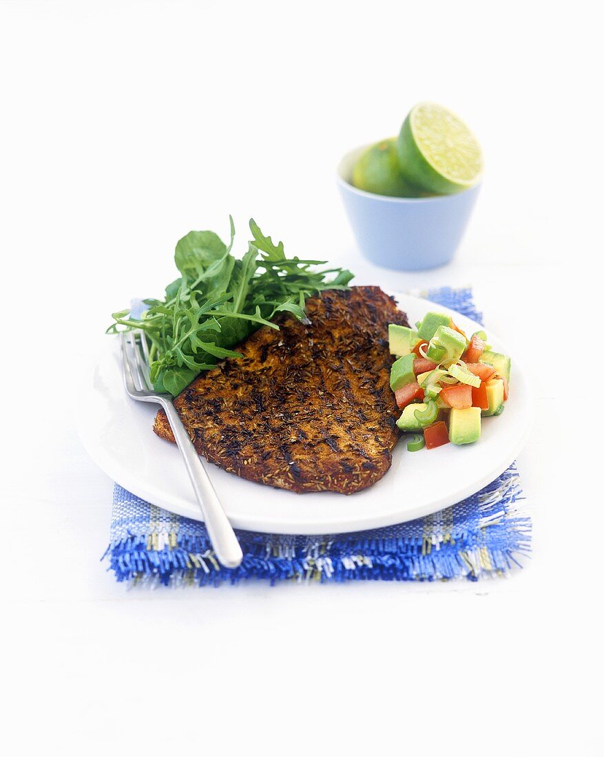 Grilled pork chop with rocket and avocado salsa