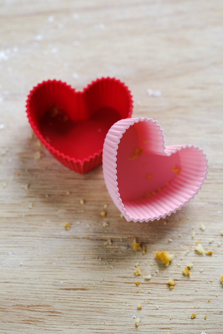 Red and pink, heart-shaped silicone baking moulds