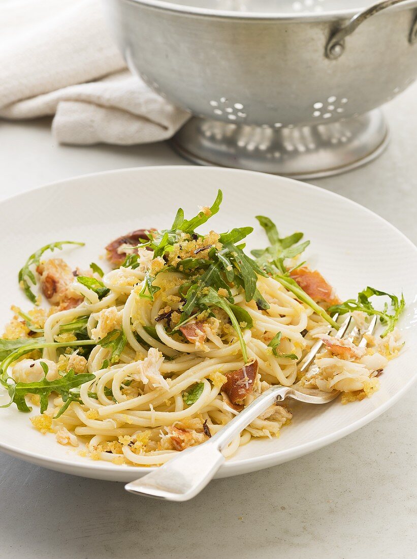 Spaghetti with crabmeat, rocket, pancetta and breadcrumbs
