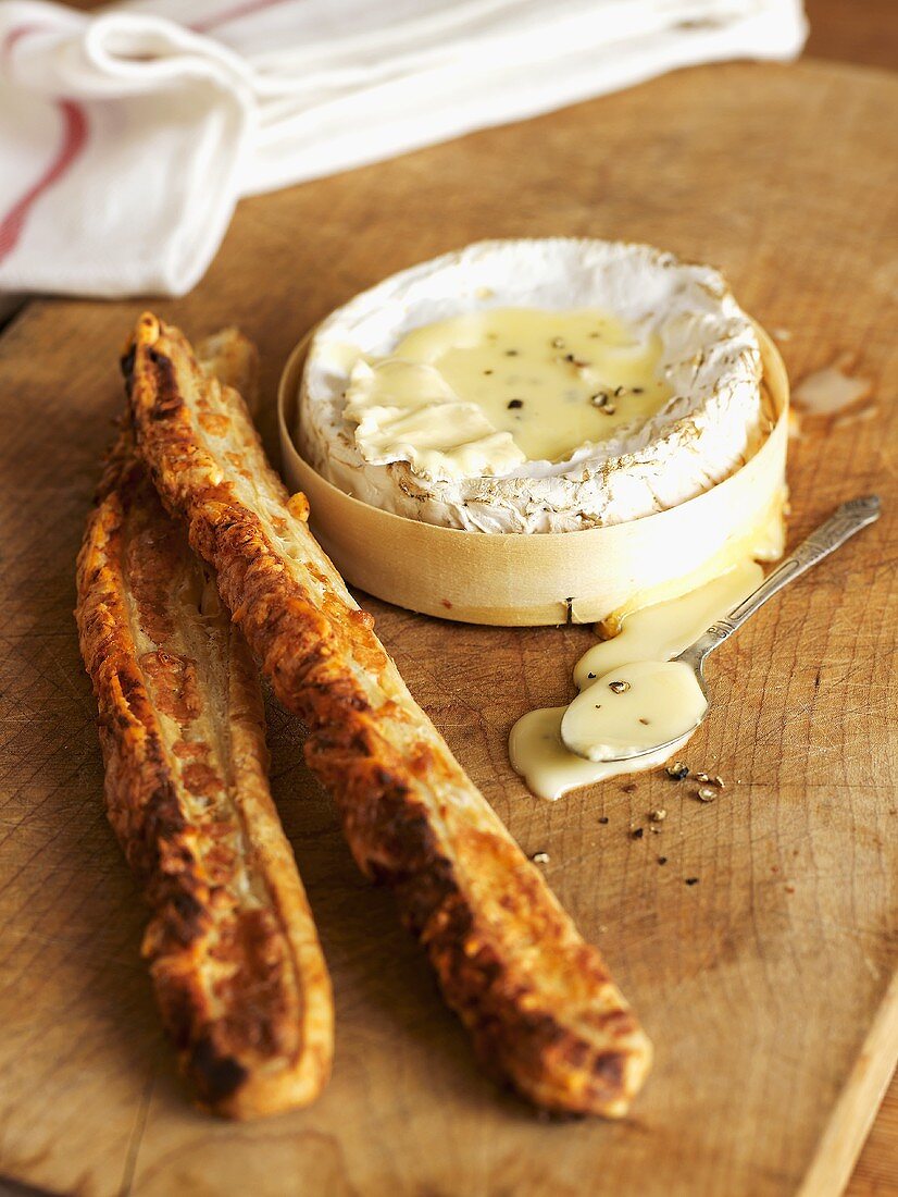 Baked cheese with cheese sticks