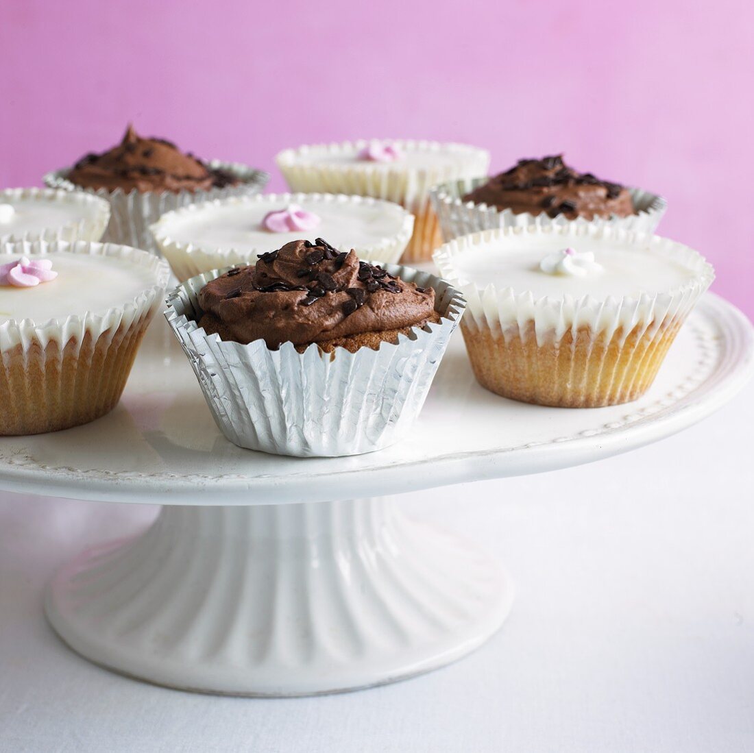 Assorted cupcakes on cake stand