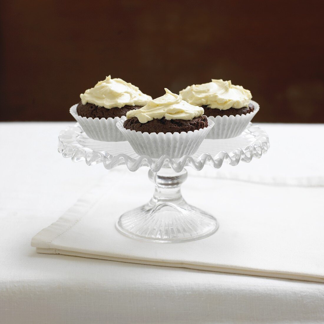 Three cupcakes on cake stand