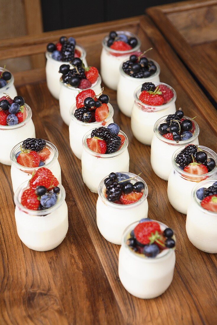Jars of yoghurt with fresh berries